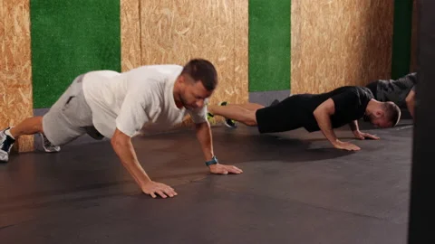 Press ups exercise, plank pose, working out, wearing sportswear, indoor. Sexy Stock Footage 197363962