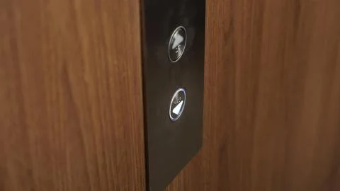 Pressed button elevator down of modern building Foto stock