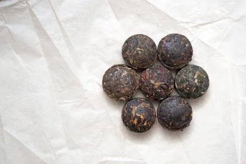Pressed puer tea in the form of round tablets. Stock Photos
