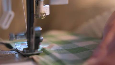 Presser foot with thread. Close up slow motion Видео 337437126