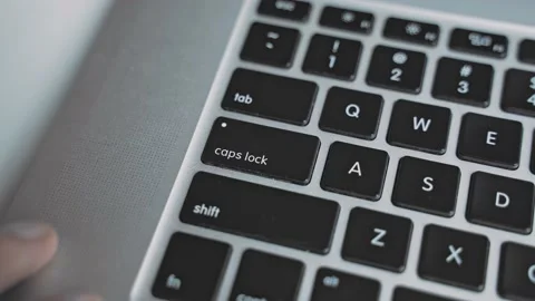 Presses Caps Lock key Stock Footage 157086218