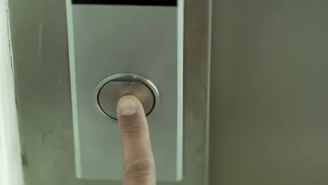 Presses the elevator button Stock-Footage 231515977