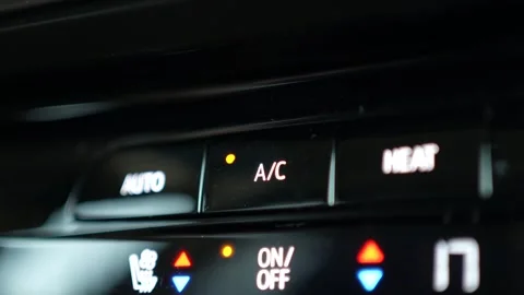 Pressing the AC Button on a Car Climate Control Panel Closeup Stock Footage 240784345