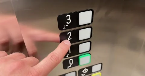Pressing Accessible Elevator Buttons with Braille Stock Footage 339771834