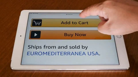 Pressing "Add to Cart" button at online shopping portal, with Apple Ipad Stock Footage 114327946