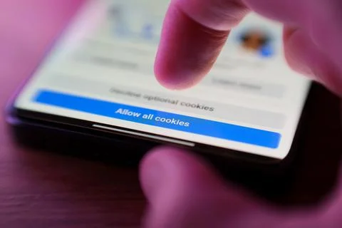Pressing Allow all cookies button on internet webpage. Internet browsing history Stock Photos