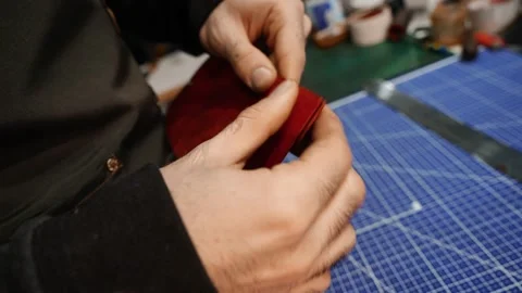 Pressing and bonding leather wallet parts together Stock Footage 314961778