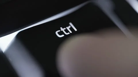 Pressing and holding the CTRL button on black computer keyboard Stock Footage 264158252