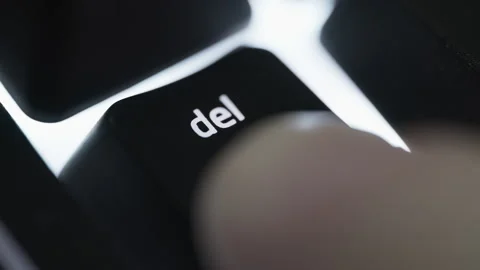 Pressing and holding delete button on black computer keyboard Stock Footage 264158411