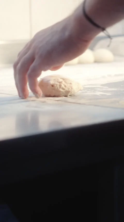 Pressing and Shaping Dough by Hand Close Up Stock Footage 344393215