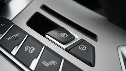 Pressing automatic parking button in car Stock Footage 264802436