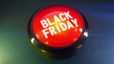 Pressing the big red button labeled with the message "Black Friday" Stock Footage 293217352