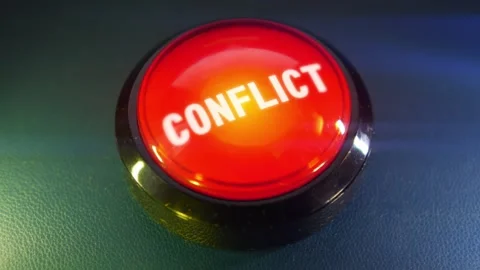 Pressing the big red button labeled with the message "Conflict" Stock Footage 293217357