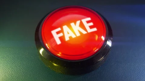 Pressing the big red button labeled with the message "Fake" Stock Footage 293217483