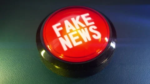 Pressing the big red button labeled with the message "Fake News" Stock Footage 293217493
