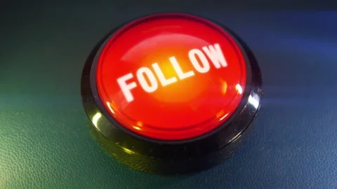 Pressing the big red button labeled with the message "Follow" Stock Footage 293217582