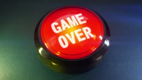 Pressing the big red button labeled with the message "Game Over" Stock-Footage 293217634