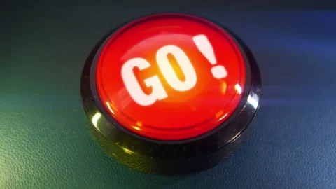 Pressing the big red button labeled with the message "Go" Stock Footage 293217731