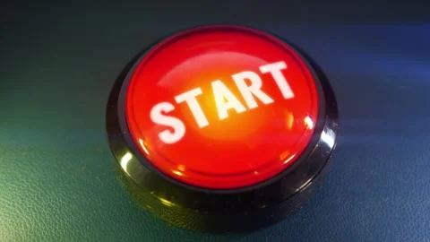 Pressing the big red button labeled with the message "Start" Stock Footage 293218052