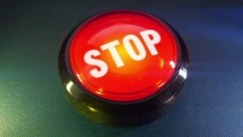 Pressing the big red button labeled with the message "Stop" Video stock 293218076