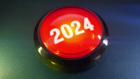 Pressing the big red button labeled with the message "2024" Video stock 293218342