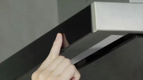 Pressing a button and taking off a kitchen ventilation Stock Footage