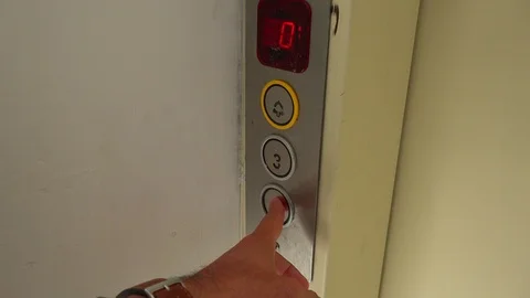 Pressing the button to call the elevator close up Stock Footage 101396784
