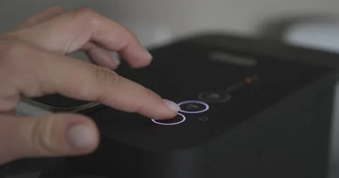 Pressing the Button on the Coffee Machine Stock Footage 168729464