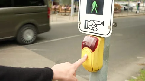 Pressing the button to make the pedestrian lights switch Stock Footage 204983102