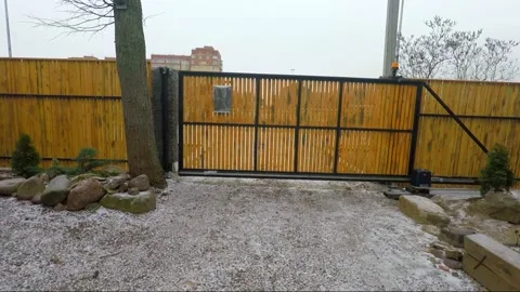 A by pressing the button on the remote control car gate opens for driving Stock Footage 145079260