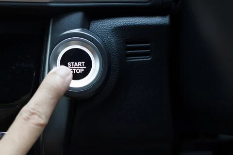 Pressing the button to start a car. Stock Photos
