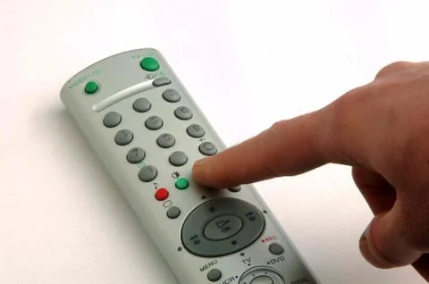 Pressing button TV remote control Stock Photos