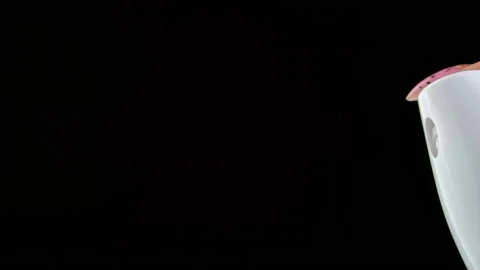 Pressing a Button on White Deodorant Spray with Jet Stream on a Black Background Stock Footage 187990543