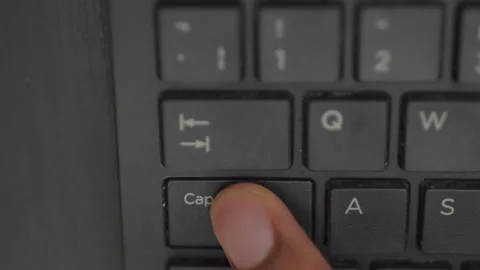 Pressing Caps Lock On Black Computer Keyboard Stock-Footage 150597615