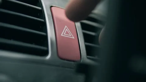Pressing car emergency lights button on dashboard Video stock 157327582