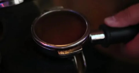 Pressing coffee to extract its essence in a coffee machine Stock Footage 301747826
