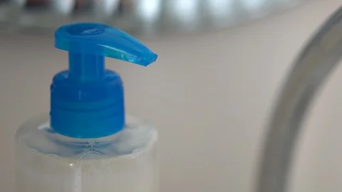 Pressing dispenser with liquid soap close up Video stock 127368690