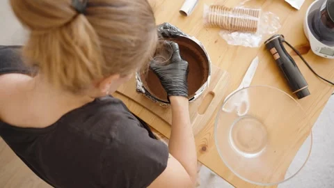 Pressing Down the Cookie Crumb Mixture, Creating a Compact Base for the Stock Footage 280083897