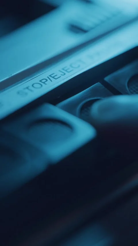 Pressing the eject button on a retro cassette recorder Video stock 337170555