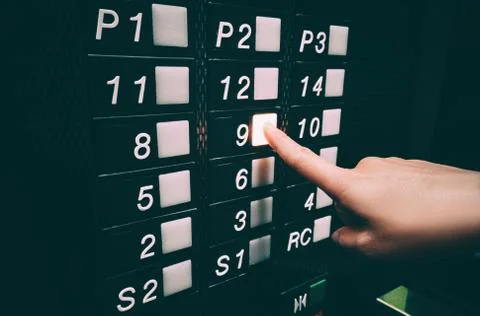 Pressing elevator button with hands, touching public surface with germs Foto stock
