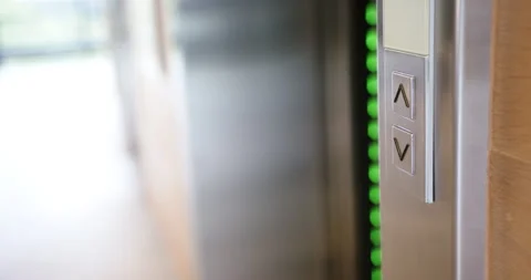 Pressing elevator button, person holding documents, waiting for elevator to Video stock 300069873