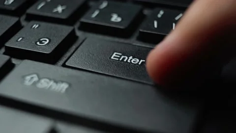 Pressing the enter button on your computer keyboard Stock Footage 165547990