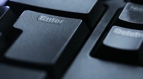 Pressing the enter key on a computer keyboard. close-up Stock Footage 56301930