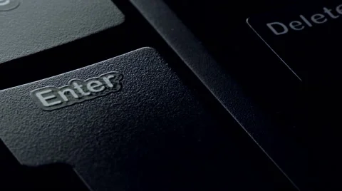 Pressing the enter key on a computer keyboard. close-up Stock Footage