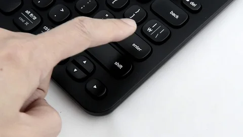 Pressing the enter key on a computer keyboard. Stock Footage 72782244