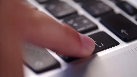 Pressing Enter key on a laptop keyboard close up. Man pushing the enter but.. Stock Footage 340958199