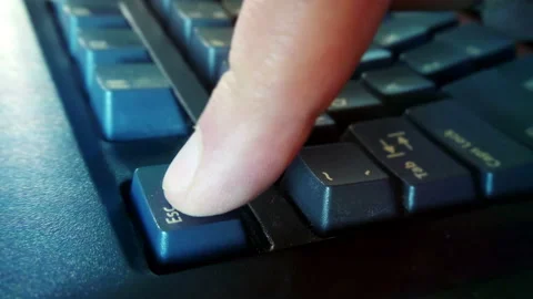 Pressing Esc key on computer keyboard Stock Footage 145290446