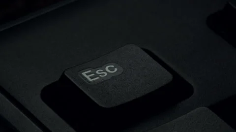 Pressing the escape key on a computer keyboard. close-up Stock Footage 59977774