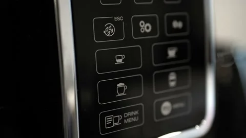 Pressing the espresso button on the coffee machine. Selecting a coffee. Stock Footage 201407351