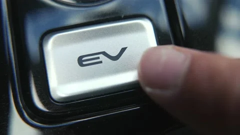 Pressing the EV Button of an Electric Vehicle Car Stock Footage